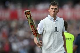 Zak Crawley batting in an England Test matchPortrait of Zak Crawley in England cricket jerseyZak Crawley playing a cover drive during a matchZak Crawley speaking at a press conferenceEngland cricketer Zak Crawley during trainingZak Crawley receiving Player of the Match award